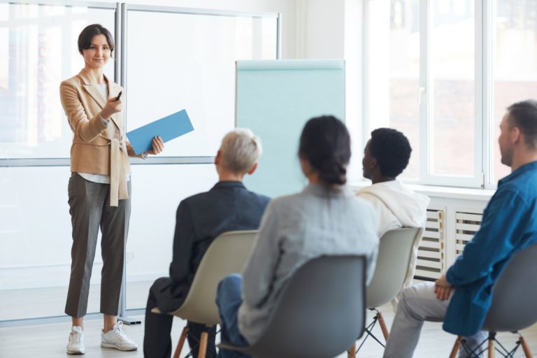 female-manager-meeting-with-employeees-in-office-LAFWSNU